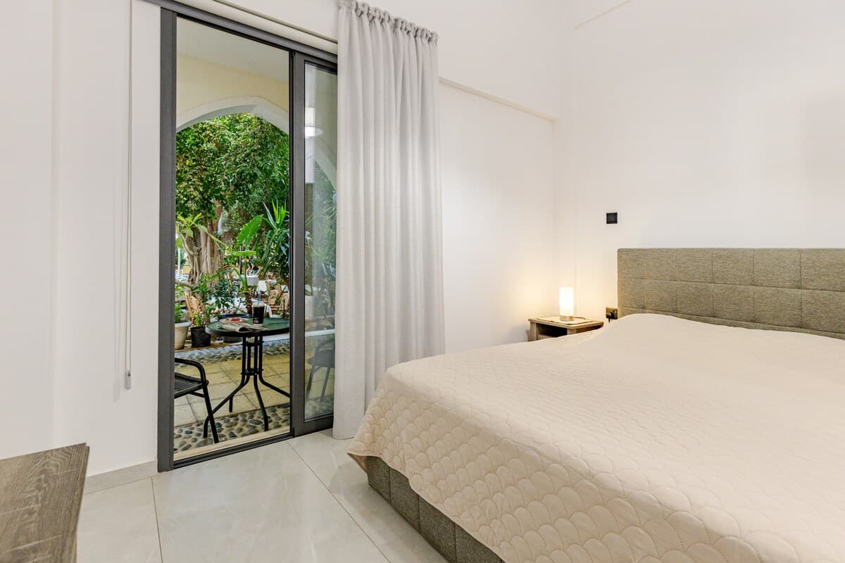 Niki Breeze bedroom overlooking the garden